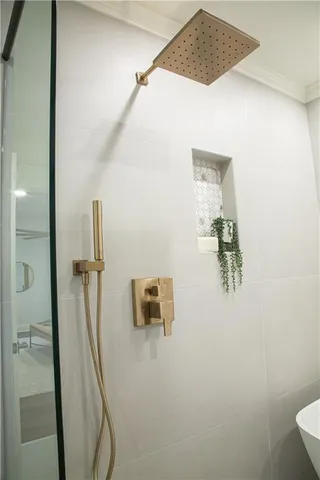 a white bath tub sitting in a bathroom