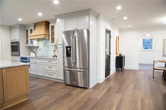a kitchen with a sink cabinets and window