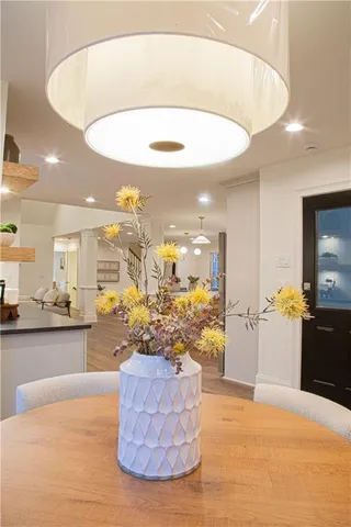 a kitchen with stainless steel appliances granite countertop white cabinets and a granite counter