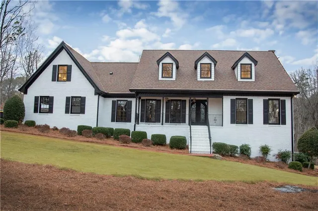 a front view of a house with a yard