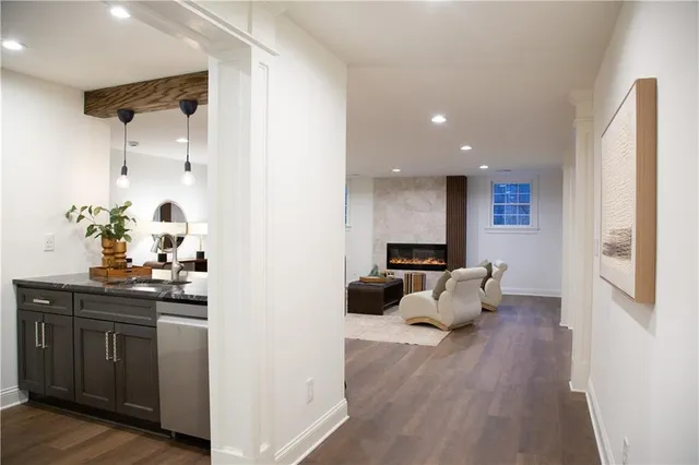 a view of a dining room with furniture and wooden floor