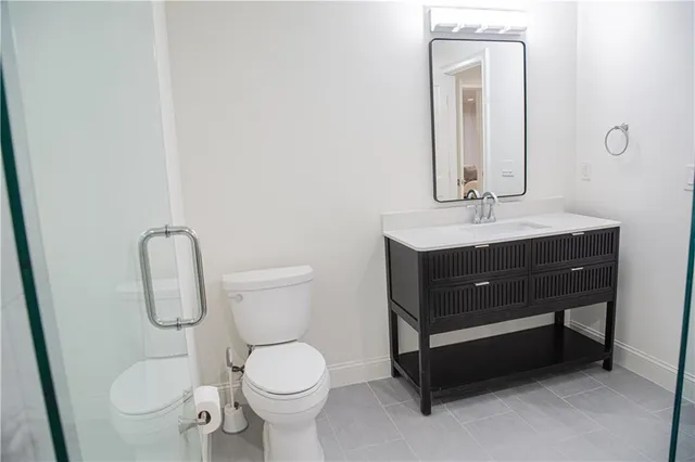 a living room with furniture and a mirror