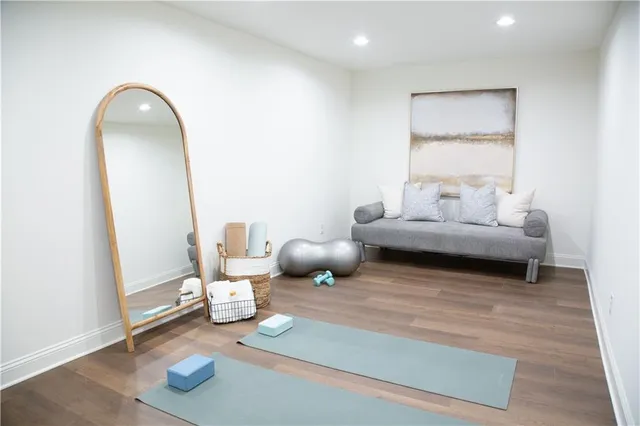 a view of a bathroom with wooden floor and a sink
