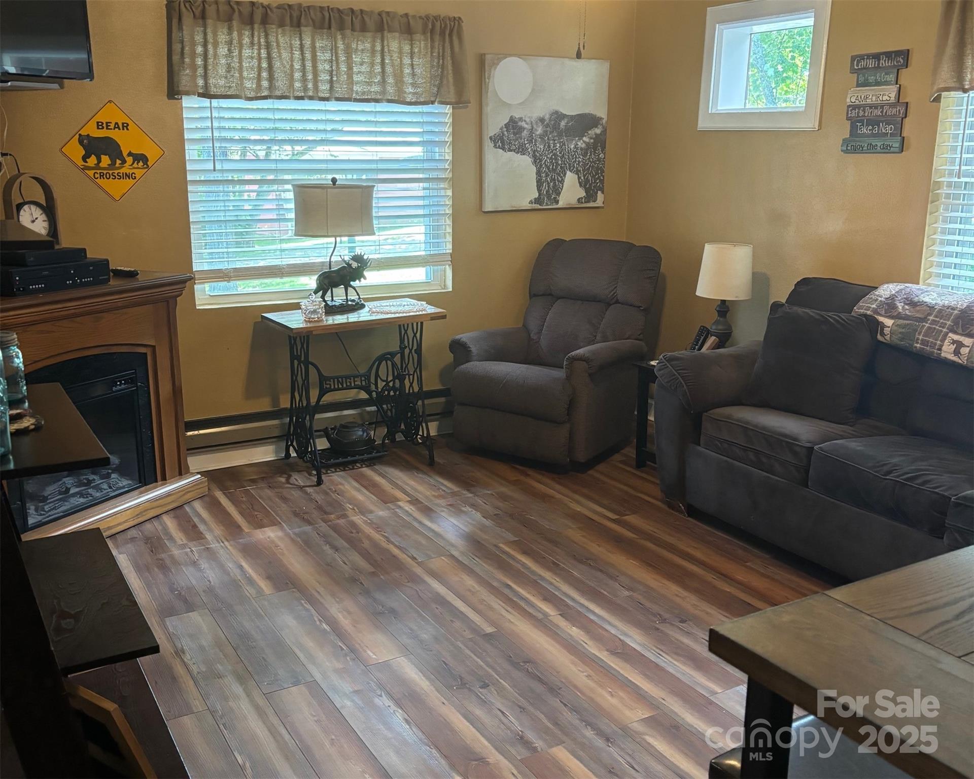 1555 Soco Road, Unit 12 Maggie Valley, NC 28751 - Photo 4 of 12 a living room with furniture and a fireplace