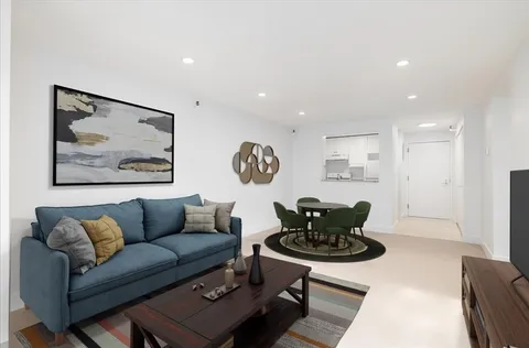 a living room with furniture and a rug