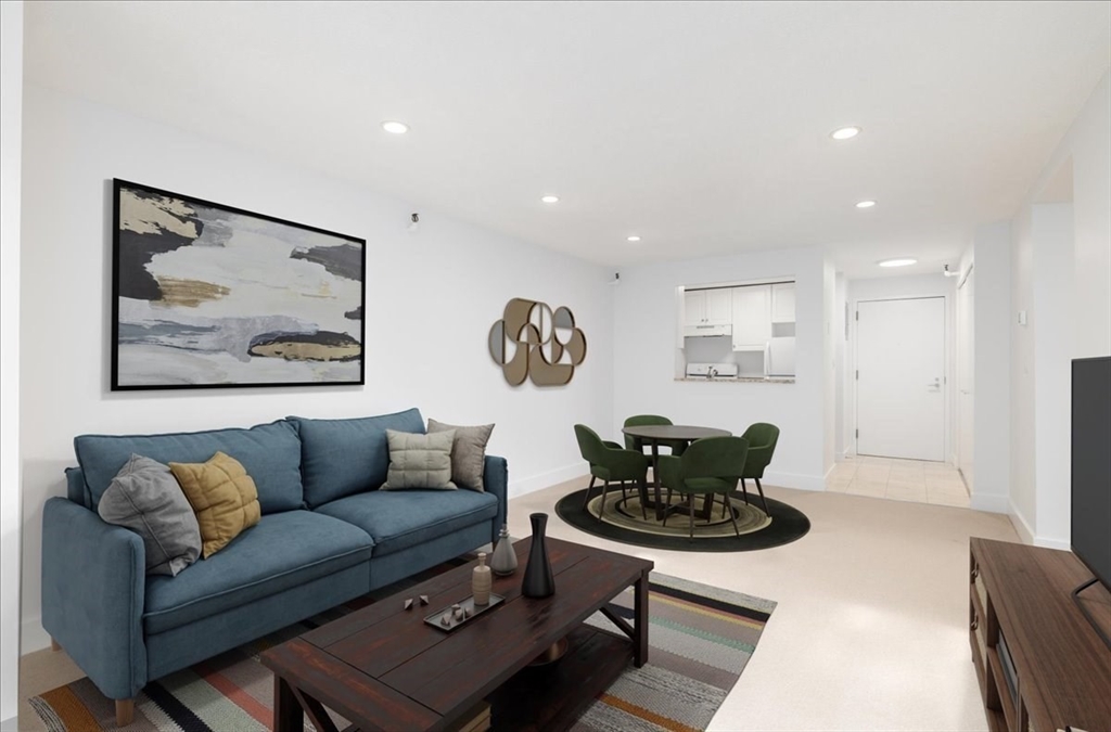 a living room with furniture and a rug