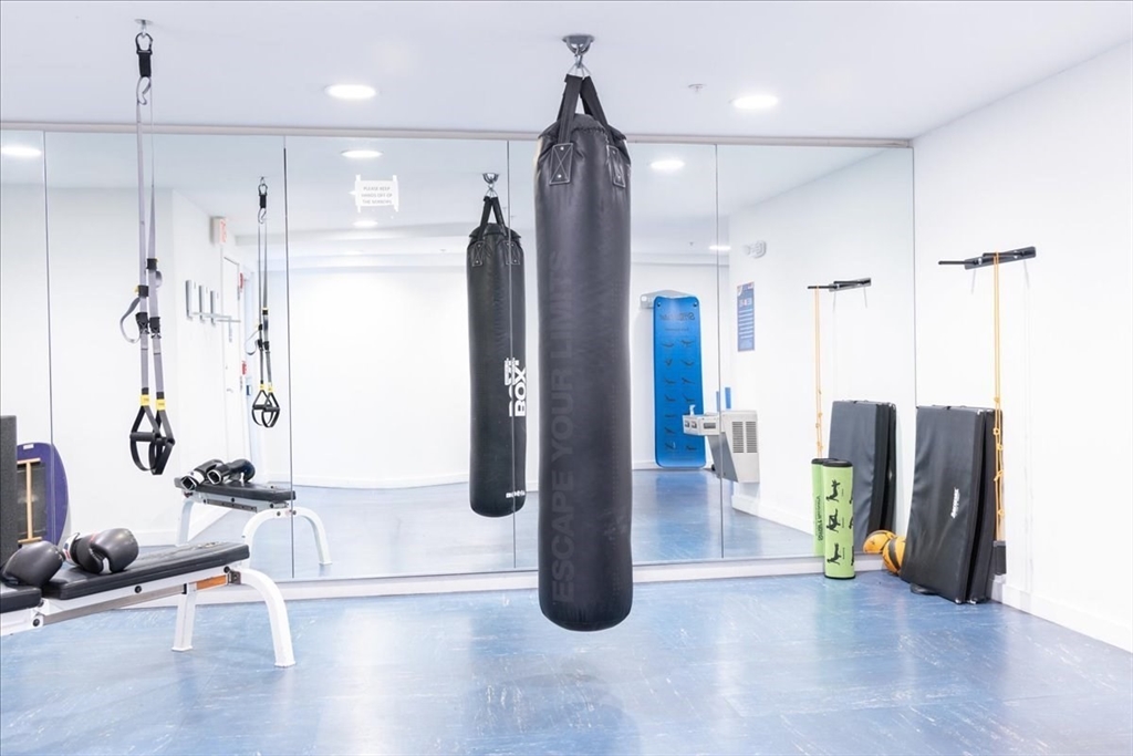 42 8th Street, Unit 5316 Boston, MA 02129 - Photo 24 of 39 a view of a kitchen with refrigerator and an entryway