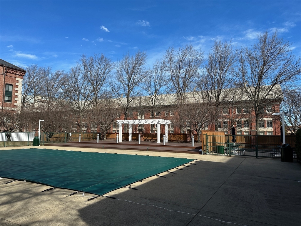 42 8th Street, Unit 5316 Boston, MA 02129 - Photo 29 of 39 a front view of a building with trees and green space