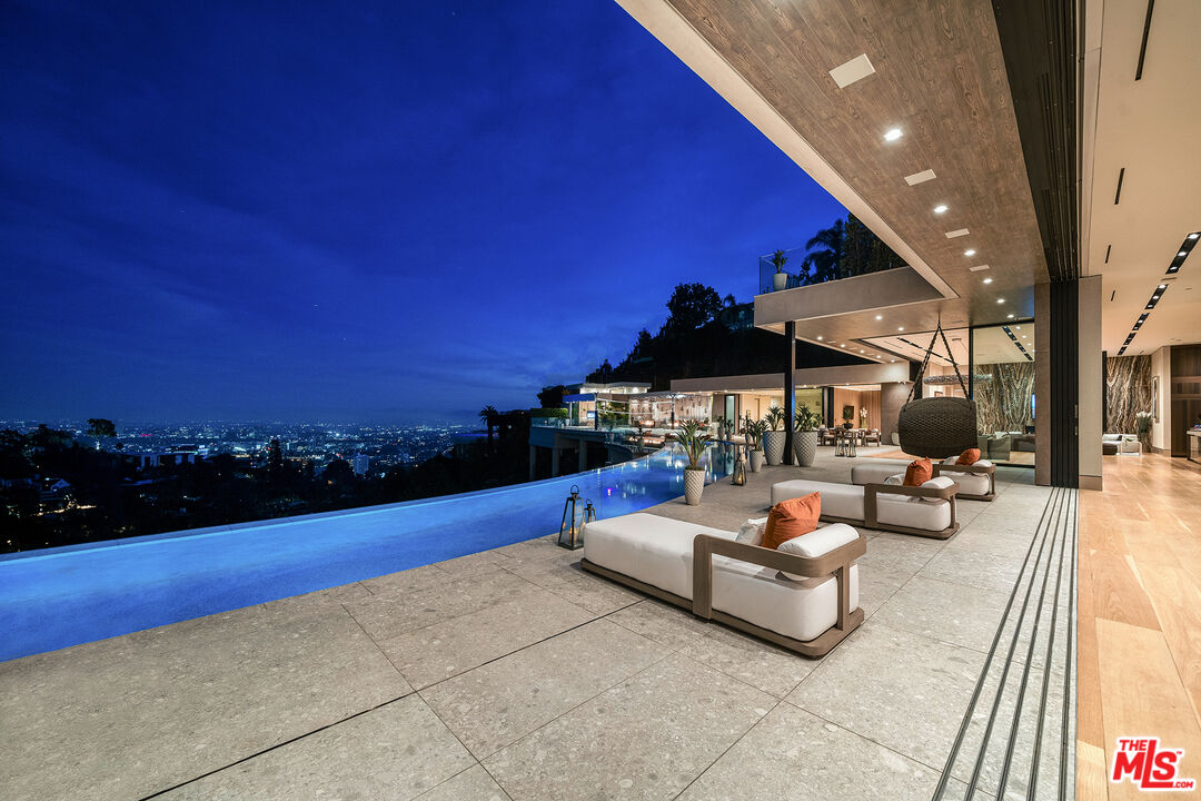a outdoor living space with furniture and city view