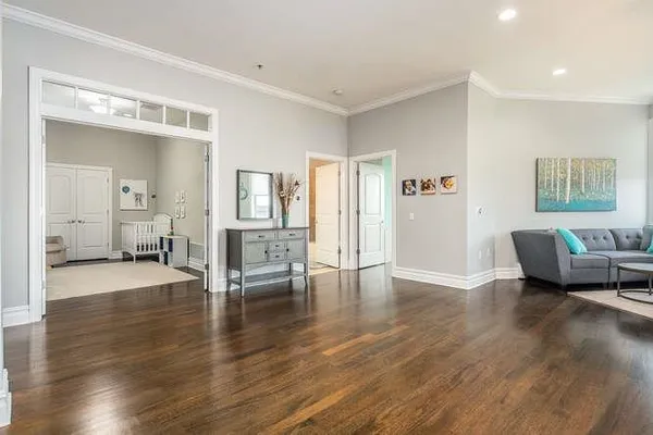 a view of a livingroom with furniture and wooden floor