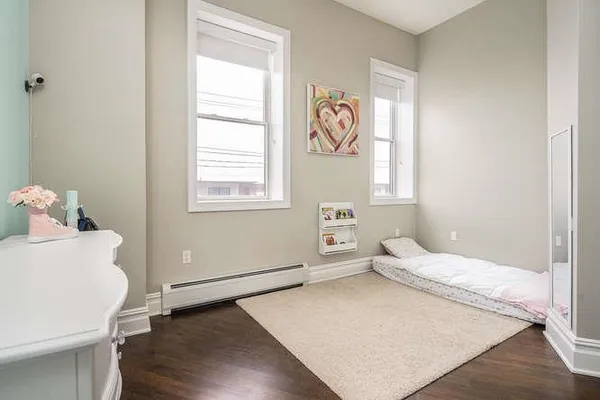 a view of a livingroom with workspace and a window