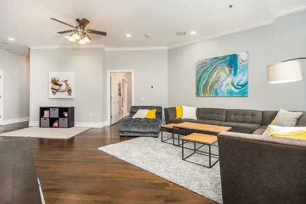 a living room with furniture and a fireplace