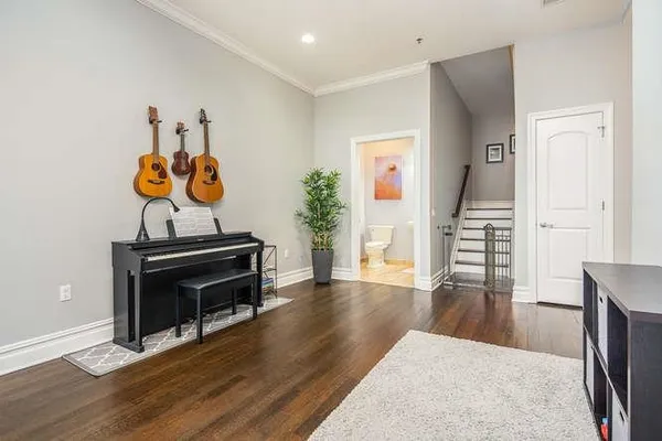 a view of a livingroom with furniture and wooden floor