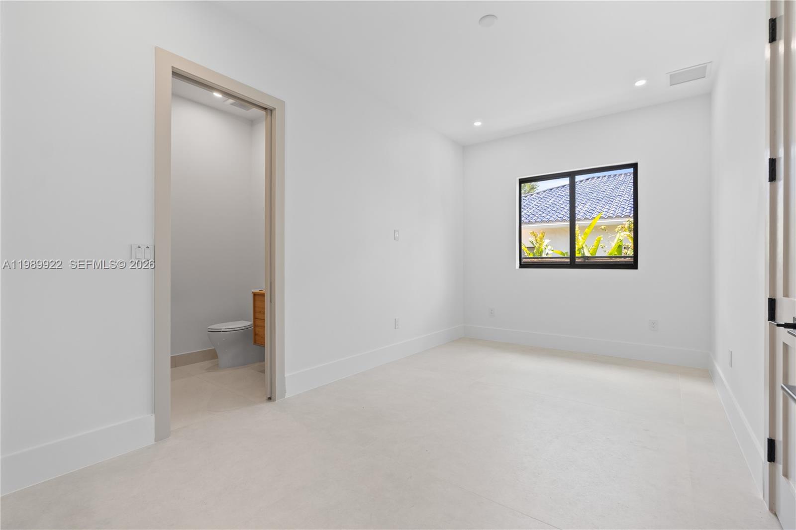 6221 Southwest 60th Street South Miami, FL 33143 - Photo 30 of 42 a view of an empty room with a window