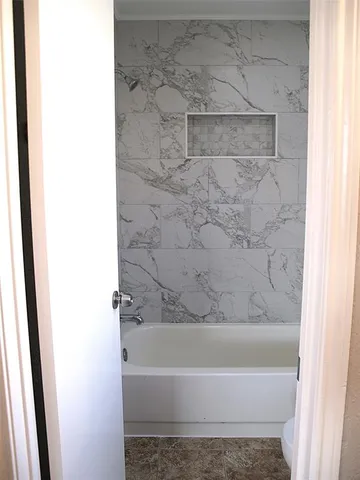 a bathroom with a bathtub