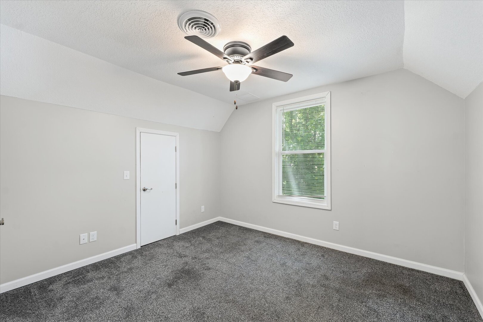 1391 West Decatur Street Decatur, IL 62522 - Photo 21 of 28 an empty room with window and a ceiling fan