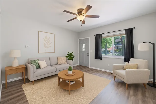 a living room with furniture and a large window