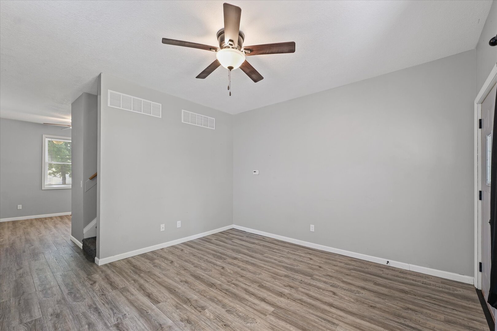 1391 West Decatur Street Decatur, IL 62522 - Photo 4 of 28 wooden floor in an empty room with a window