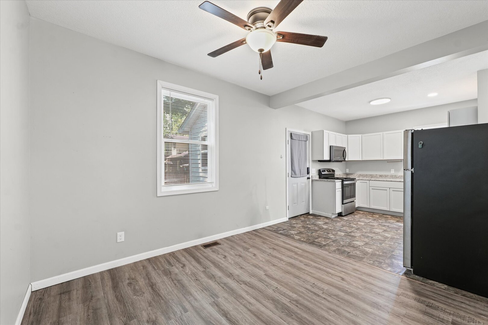 1391 West Decatur Street Decatur, IL 62522 - Photo 7 of 28 a view of kitchen with stainless steel appliances granite countertop a refrigerator and a stove top oven