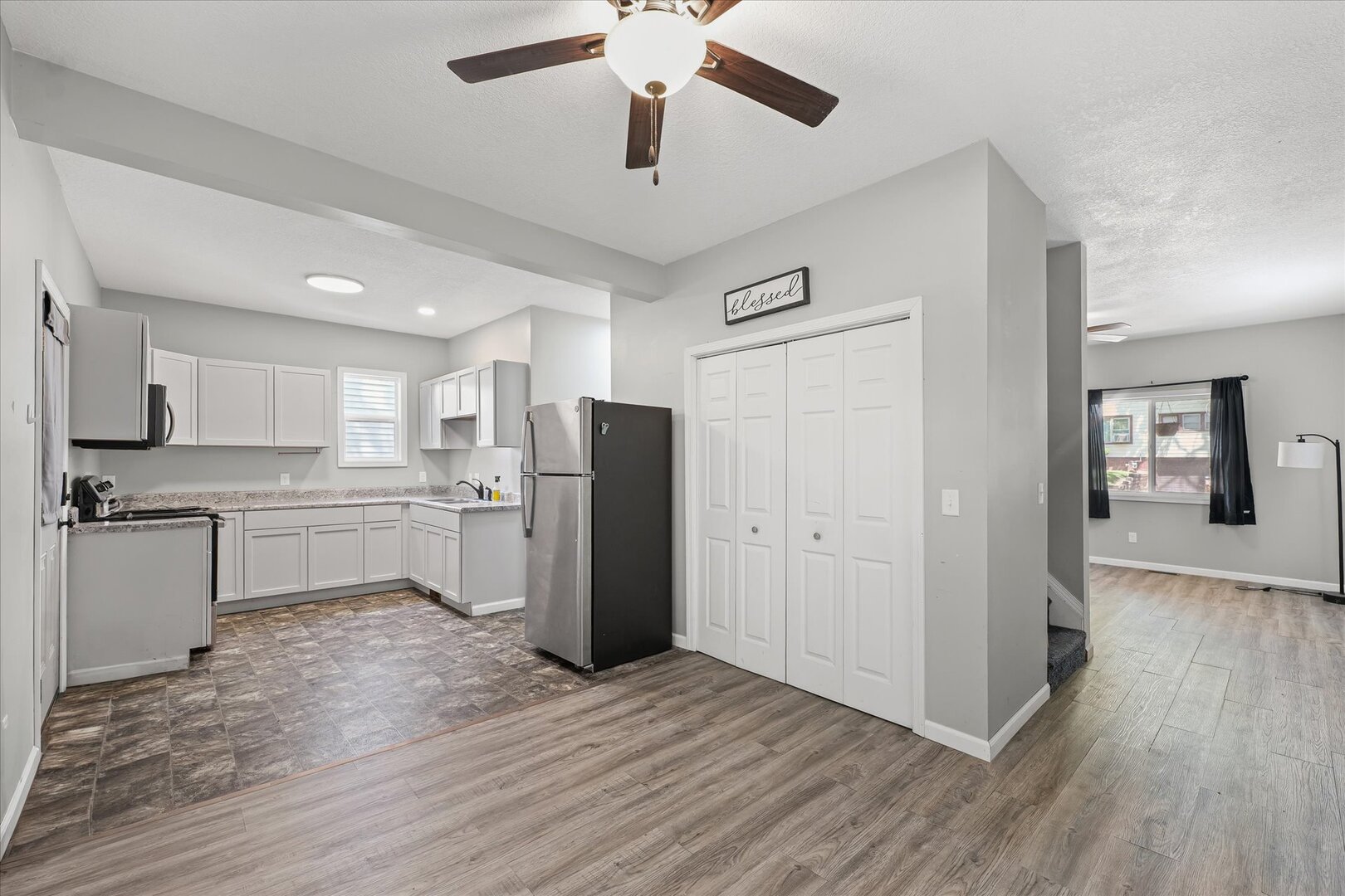 1391 West Decatur Street Decatur, IL 62522 - Photo 8 of 28 a kitchen with refrigerator cabinets and wooden floor