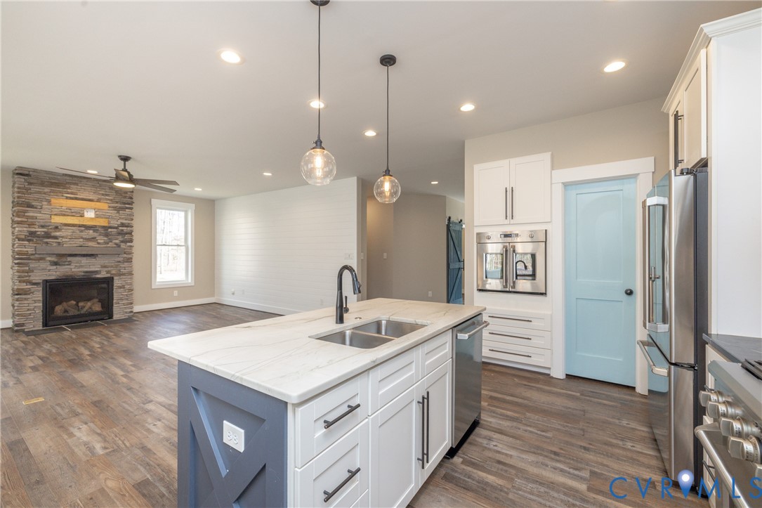 2744 Dogtown Road Goochland, VA 23063 - Photo 11 of 46 a kitchen with sink refrigerator and fireplace