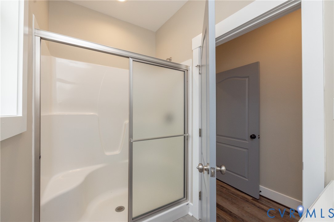 2744 Dogtown Road Goochland, VA 23063 - Photo 17 of 46 a bathroom with a glass shower door