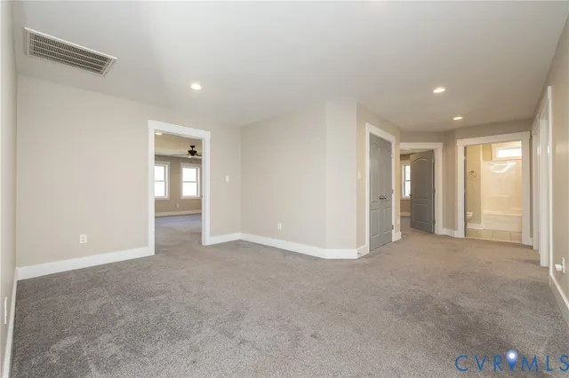 a view of an empty room with glass door