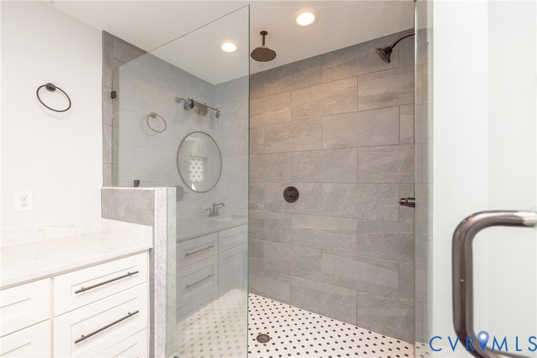 2744 Dogtown Road Goochland, VA 23063 - Photo 28 of 46 a bathroom with a shower a mirror and a shower