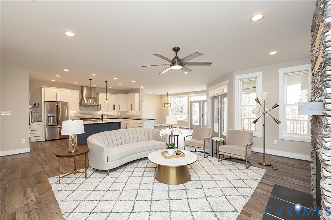 2744 Dogtown Road Goochland, VA 23063 - Photo 9 of 46 a living room with furniture a table and kitchen view