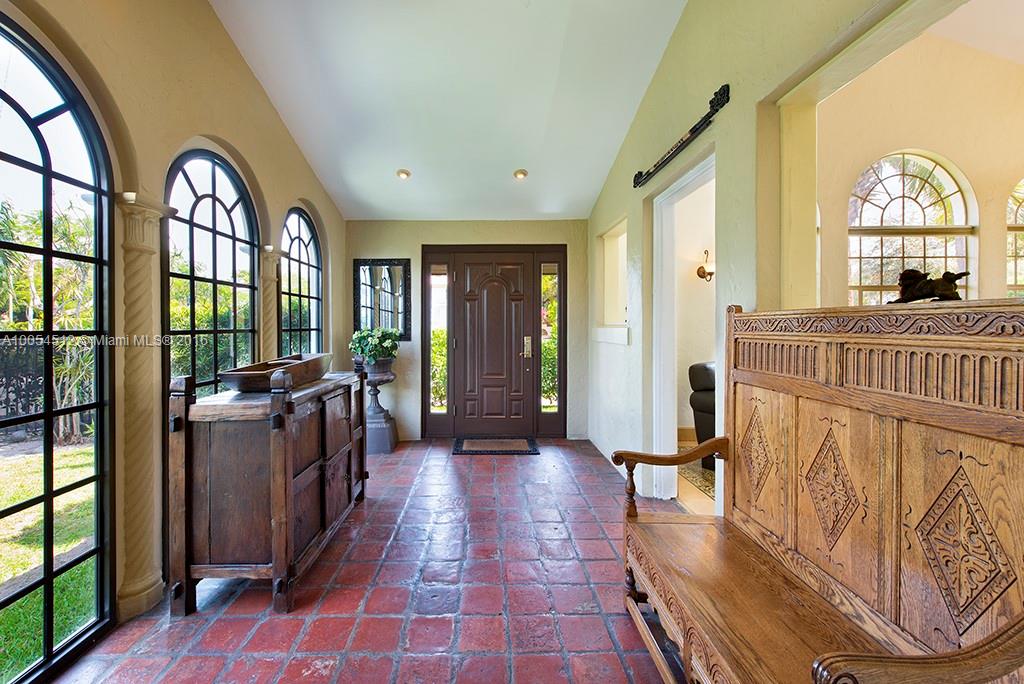 4236 Alton Road Miami Beach, FL 33140 - Photo 17 of 24 a view of a entryway door with interior of the house