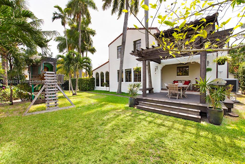 4236 Alton Road Miami Beach, FL 33140 - Photo 3 of 24 a view of a house with swimming pool and sitting area