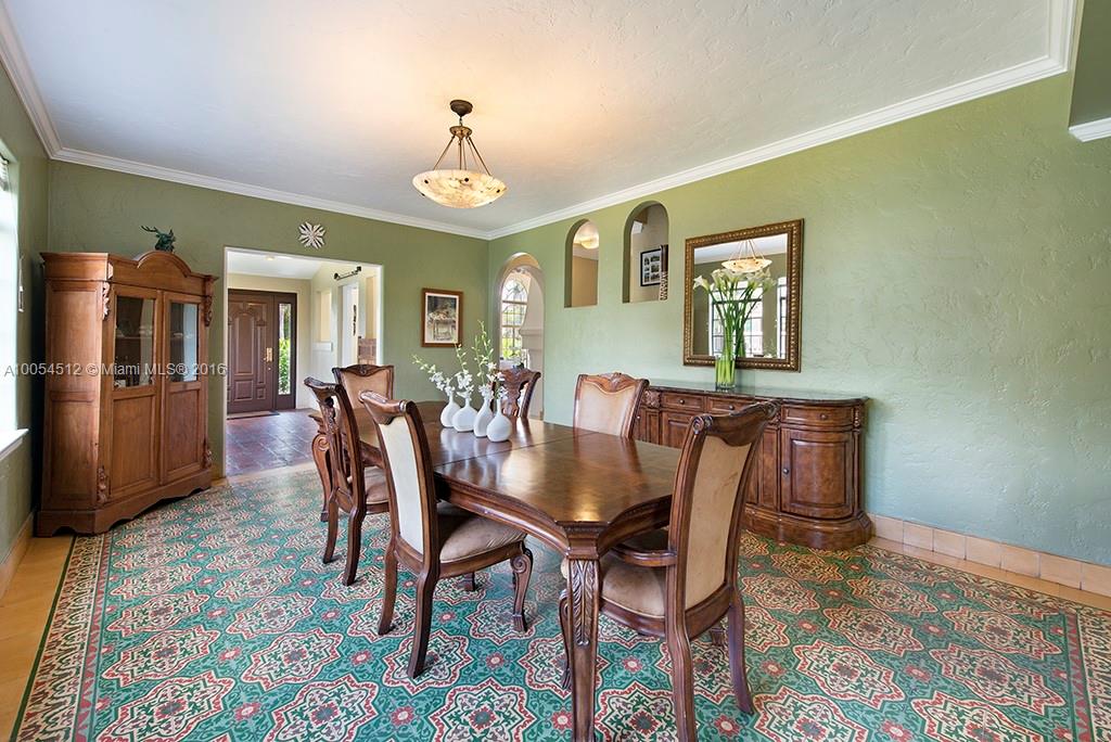 4236 Alton Road Miami Beach, FL 33140 - Photo 5 of 24 a view of a dining room with furniture