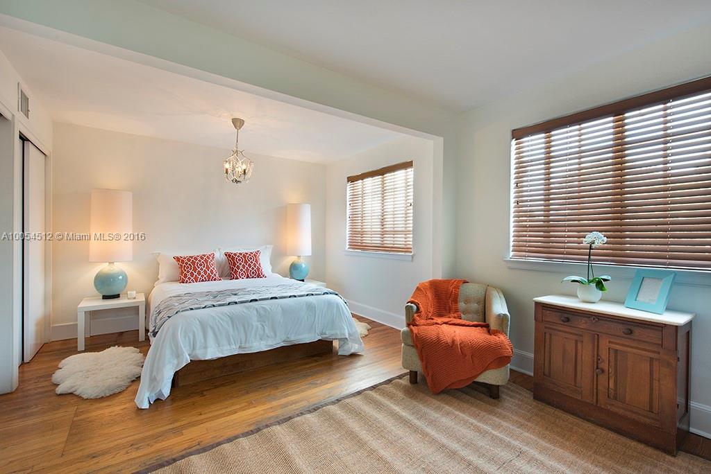 4236 Alton Road Miami Beach, FL 33140 - Photo 7 of 24 a bedroom with a bed and window