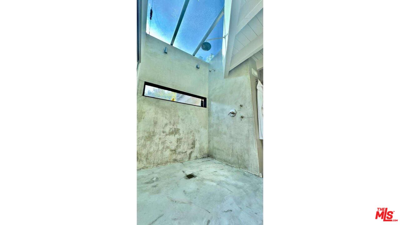 19562 Cave Way Topanga, CA 90290 - Photo 16 of 29 a bathroom with a shower and a sink