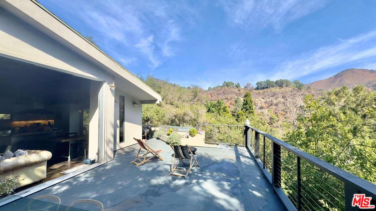 19562 Cave Way Topanga, CA 90290 - Photo 23 of 29 a view of a balcony with chairs