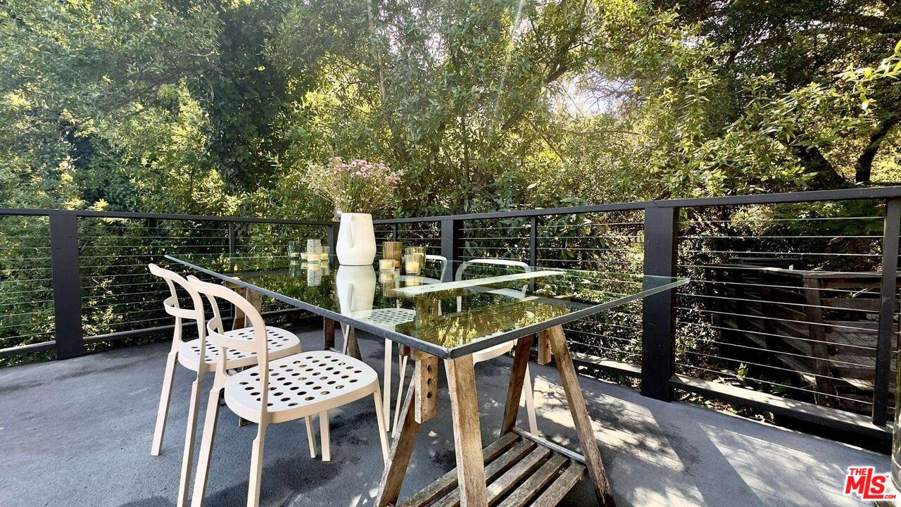 19562 Cave Way Topanga, CA 90290 - Photo 27 of 29 a roof deck with a table and chairs