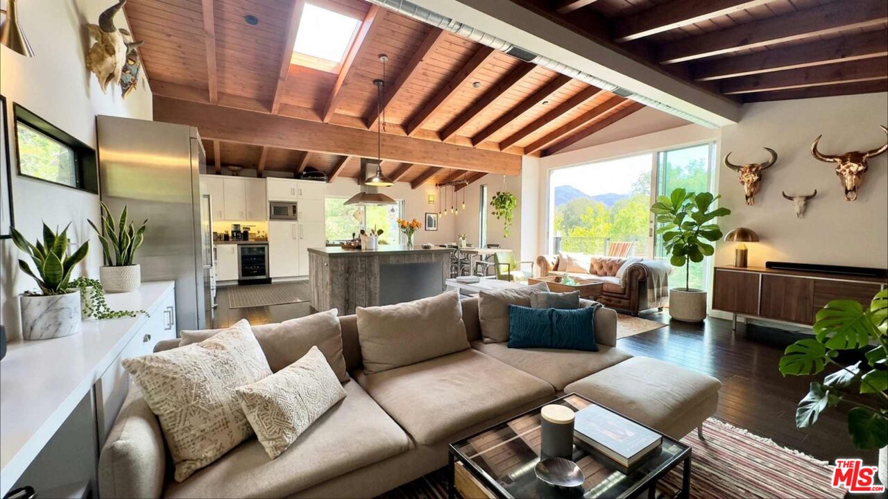 19562 Cave Way Topanga, CA 90290 - Photo 4 of 29 a living room with furniture and a large window