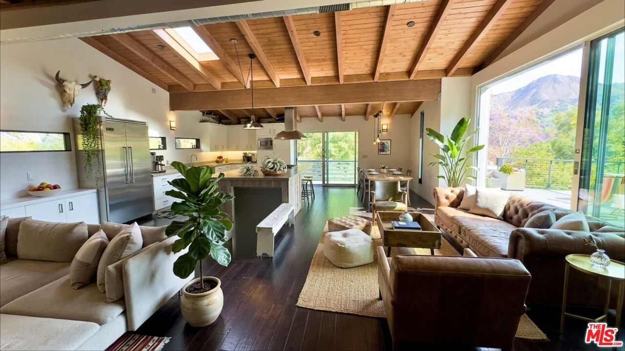 19562 Cave Way Topanga, CA 90290 - Photo 5 of 29 a living room with furniture and a large window