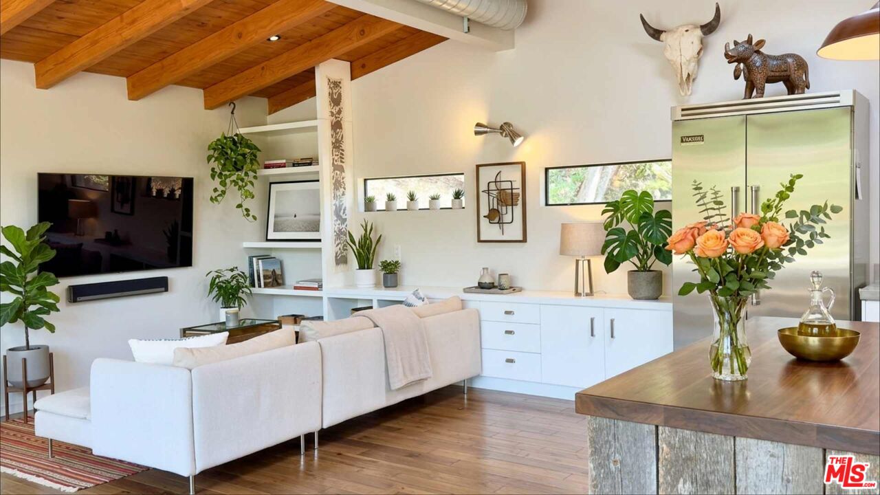 19562 Cave Way Topanga, CA 90290 - Photo 6 of 29 a living room with furniture and a flat screen tv