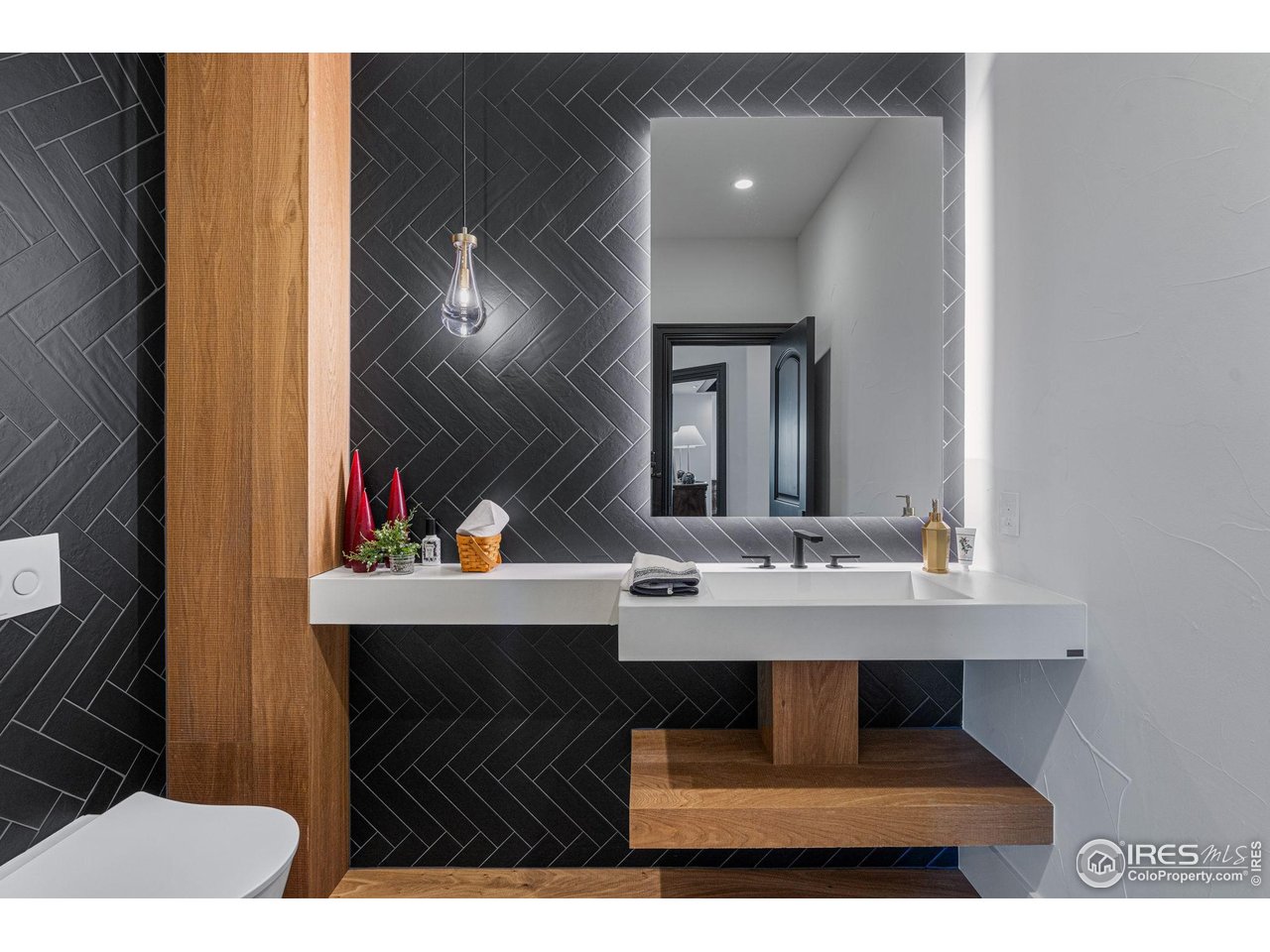 166 Valley View Way Boulder, CO 80304 - Photo 16 of 40 a bathroom with a sink and a mirror