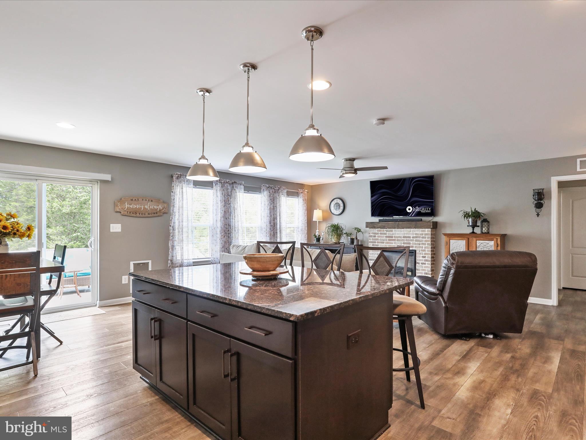 164 Stager Avenue Falling Waters, WV 25419 - Photo 19 of 46 a kitchen with kitchen island granite countertop a sink counter top space and stainless steel appliances