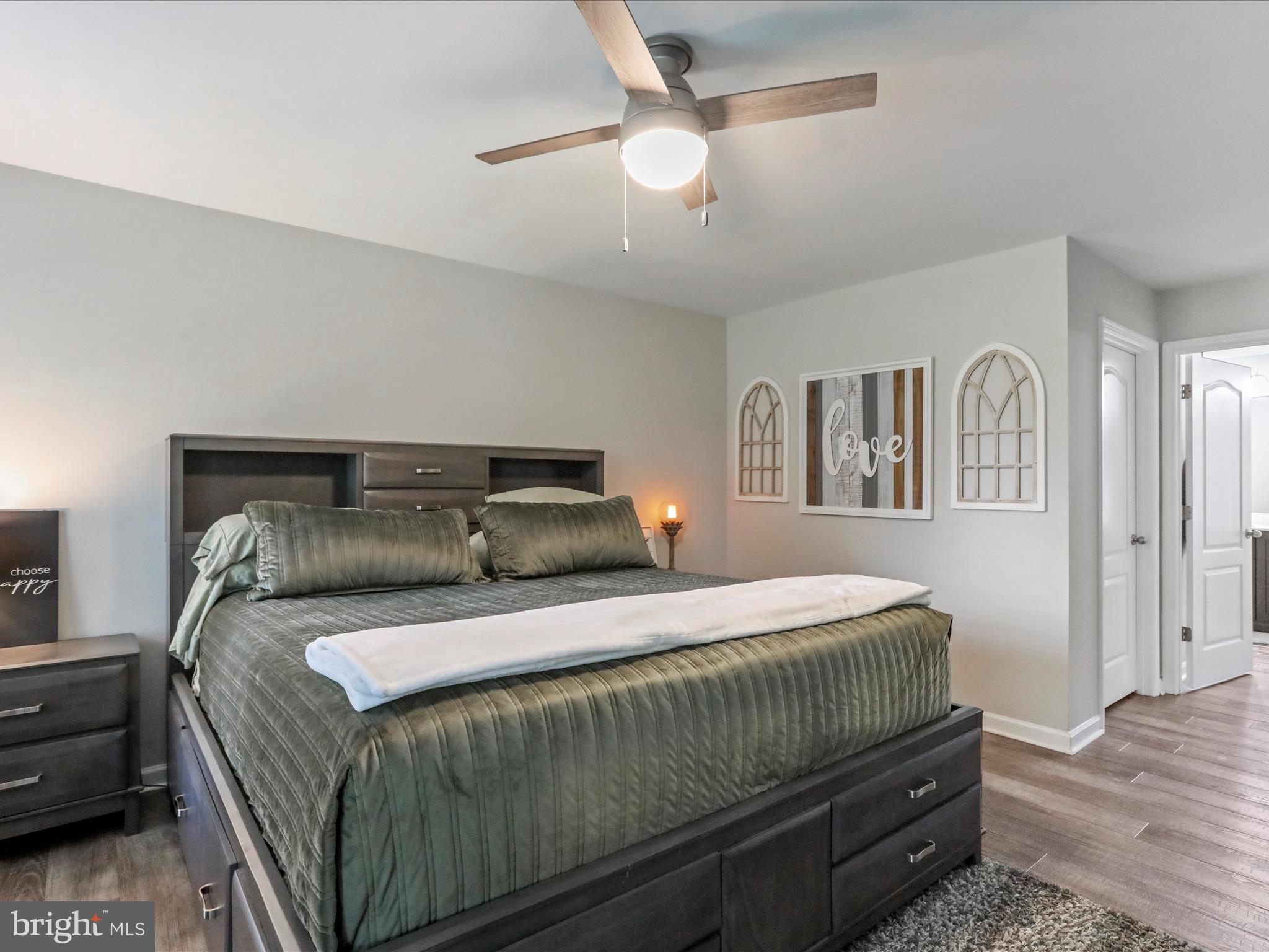 164 Stager Avenue Falling Waters, WV 25419 - Photo 24 of 46 a bedroom with a bed and a chandelier