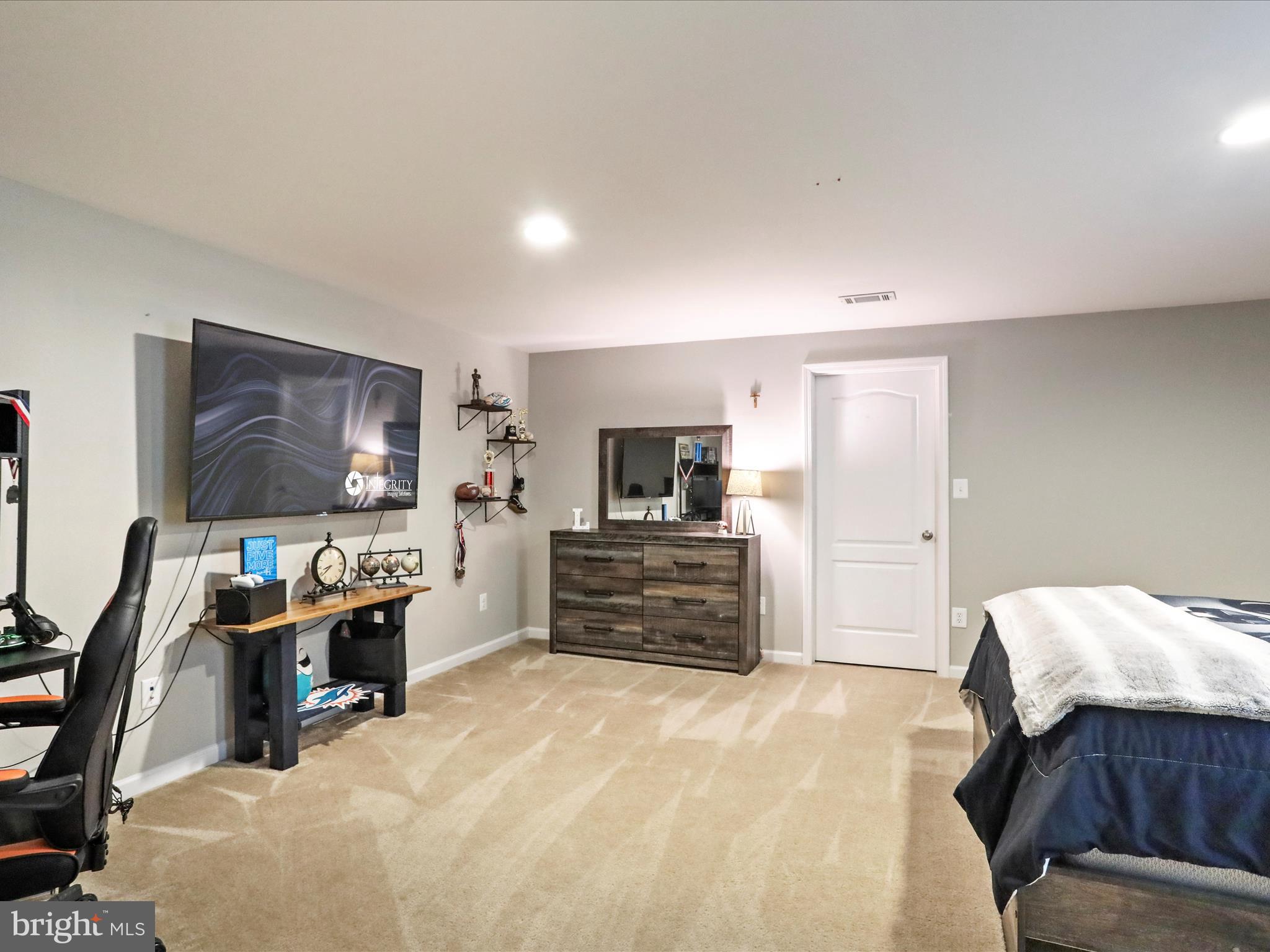 164 Stager Avenue Falling Waters, WV 25419 - Photo 35 of 46 a view of a bedroom with furniture and flat screen tv