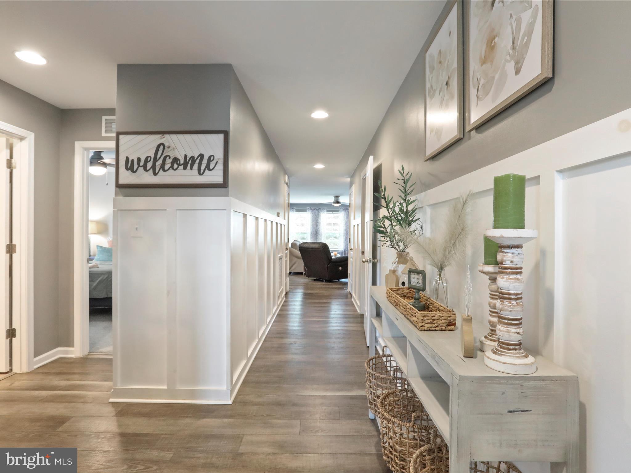 164 Stager Avenue Falling Waters, WV 25419 - Photo 5 of 46 a hallway with a large mirror on a table in a kitchen