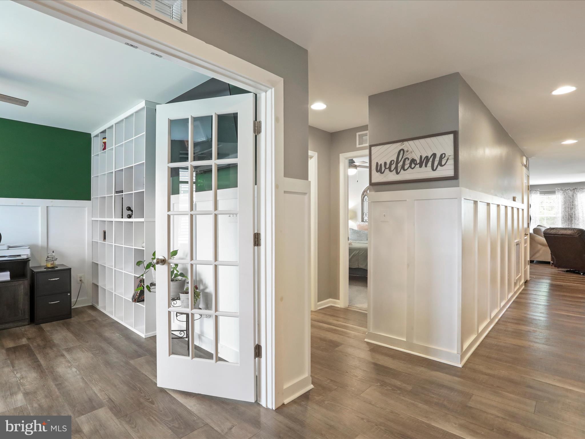 164 Stager Avenue Falling Waters, WV 25419 - Photo 6 of 46 a view of a hallway with wooden floor and furniture