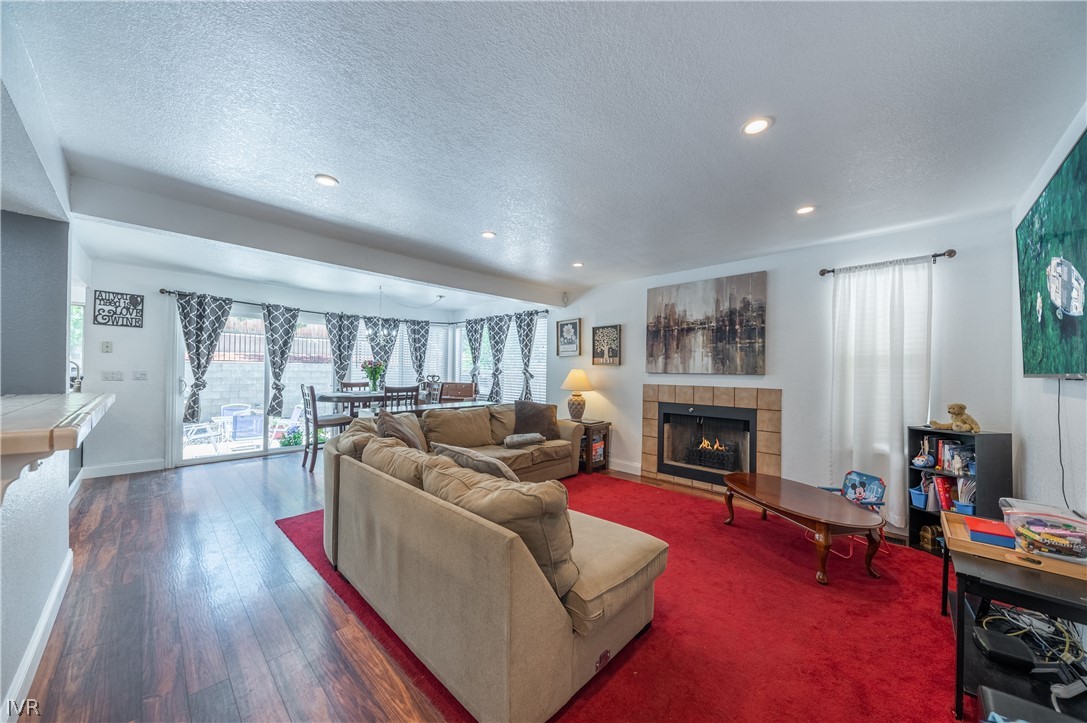 6910 Flower Street Reno, NV 89506 - Photo 4 of 27 a living room with furniture fireplace and flat screen tv