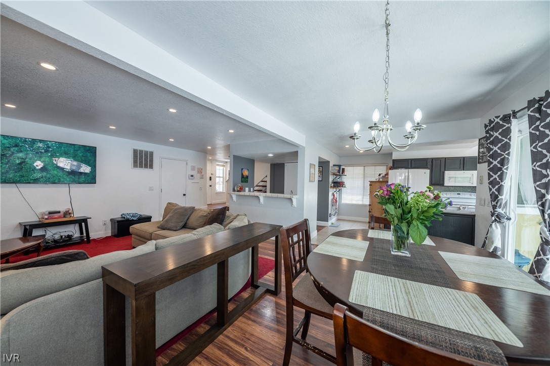 6910 Flower Street Reno, NV 89506 - Photo 7 of 27 a living room with furniture and a chandelier