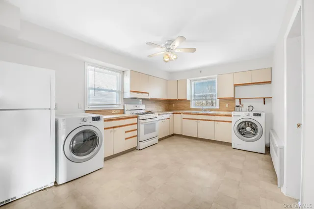 a view of a kitchen with washer and dryer