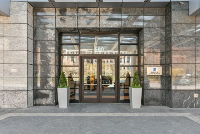 a view of a building with a glass door