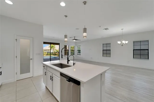 a view of a room with wooden floor and iron fence